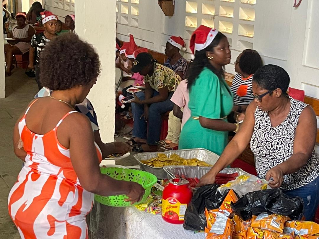 Volunteers preparing food and refreshments for children